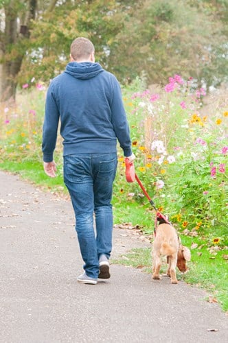 man walking a dog