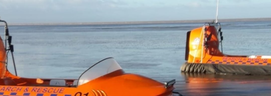 Two search and rescue life boats in the water.